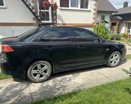 Черный Мицубиси Лансер, объемом двигателя 2 л и пробегом 210 тыс. км за 6250 $, фото 3 на Automoto.ua