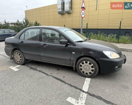 Чорний Міцубісі Lancer, об'ємом двигуна 1.58 л та пробігом 388 тис. км за 2300 $, фото 4 на Automoto.ua