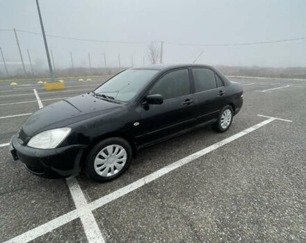 Черный Мицубиси Лансер, объемом двигателя 1.58 л и пробегом 214 тыс. км за 4400 $, фото 6 на Automoto.ua