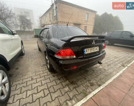 Черный Мицубиси Лансер, объемом двигателя 1.58 л и пробегом 211 тыс. км за 6333 $, фото 21 на Automoto.ua