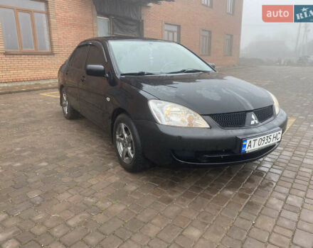 Черный Мицубиси Лансер, объемом двигателя 1.58 л и пробегом 211 тыс. км за 6333 $, фото 14 на Automoto.ua