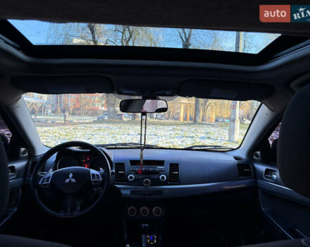 Черный Мицубиси Лансер, объемом двигателя 2 л и пробегом 236 тыс. км за 6450 $, фото 6 на Automoto.ua