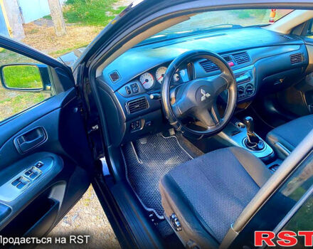 Чорний Міцубісі Lancer, об'ємом двигуна 1.6 л та пробігом 219 тис. км за 4800 $, фото 4 на Automoto.ua
