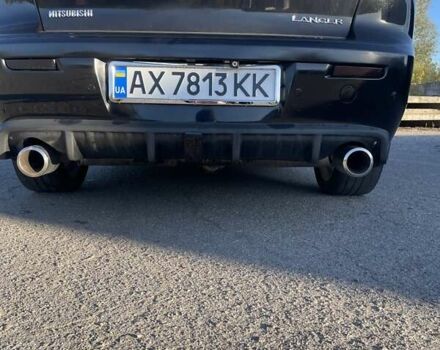 Чорний Міцубісі Lancer, об'ємом двигуна 2 л та пробігом 223 тис. км за 7800 $, фото 9 на Automoto.ua