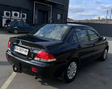 Чорний Міцубісі Lancer, об'ємом двигуна 1.6 л та пробігом 310 тис. км за 3500 $, фото 11 на Automoto.ua