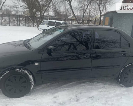 Чорний Міцубісі Lancer, об'ємом двигуна 1.58 л та пробігом 212 тис. км за 4799 $, фото 1 на Automoto.ua