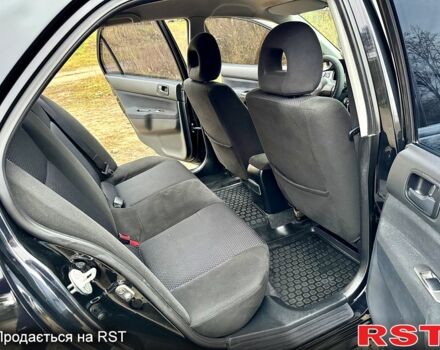 Черный Мицубиси Лансер, объемом двигателя 1.6 л и пробегом 216 тыс. км за 5190 $, фото 10 на Automoto.ua