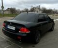 Чорний Міцубісі Lancer, об'ємом двигуна 1.6 л та пробігом 380 тис. км за 4350 $, фото 3 на Automoto.ua