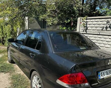 Чорний Міцубісі Lancer, об'ємом двигуна 1.6 л та пробігом 294 тис. км за 6500 $, фото 8 на Automoto.ua