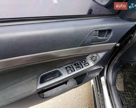 Черный Мицубиси Лансер, объемом двигателя 2 л и пробегом 200 тыс. км за 5100 $, фото 7 на Automoto.ua