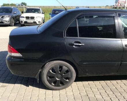 Черный Мицубиси Лансер, объемом двигателя 1.6 л и пробегом 356 тыс. км за 4590 $, фото 2 на Automoto.ua