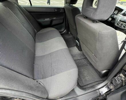 Чорний Міцубісі Lancer, об'ємом двигуна 1.6 л та пробігом 245 тис. км за 4500 $, фото 19 на Automoto.ua