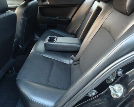 Черный Мицубиси Лансер, объемом двигателя 2 л и пробегом 245 тыс. км за 5600 $, фото 5 на Automoto.ua