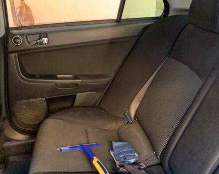 Черный Мицубиси Лансер, объемом двигателя 2 л и пробегом 210 тыс. км за 7000 $, фото 2 на Automoto.ua