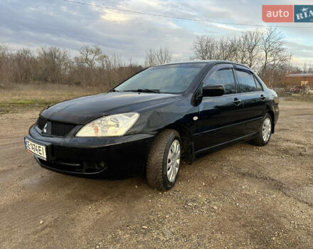 Черный Мицубиси Лансер, объемом двигателя 1.58 л и пробегом 312 тыс. км за 4900 $, фото 1 на Automoto.ua