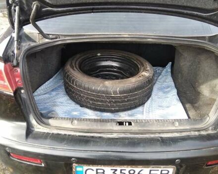 Черный Мицубиси Лансер, объемом двигателя 1.5 л и пробегом 219 тыс. км за 6000 $, фото 9 на Automoto.ua