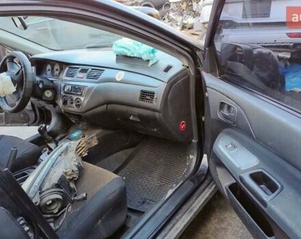 Черный Мицубиси Лансер, объемом двигателя 1.6 л и пробегом 200 тыс. км за 2000 $, фото 6 на Automoto.ua