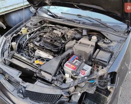 Черный Мицубиси Лансер, объемом двигателя 1.6 л и пробегом 200 тыс. км за 2000 $, фото 5 на Automoto.ua