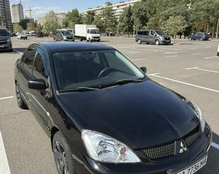 Черный Мицубиси Лансер, объемом двигателя 1.6 л и пробегом 321 тыс. км за 5000 $, фото 5 на Automoto.ua