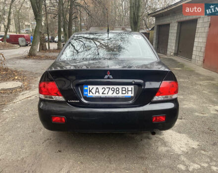 Черный Мицубиси Лансер, объемом двигателя 1.6 л и пробегом 143 тыс. км за 3000 $, фото 1 на Automoto.ua