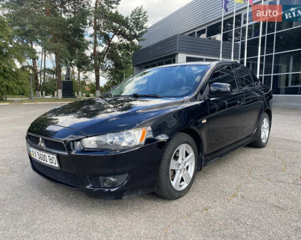 Черный Мицубиси Лансер, объемом двигателя 2 л и пробегом 200 тыс. км за 5500 $, фото 1 на Automoto.ua