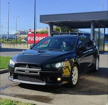 Чорний Міцубісі Lancer, об'ємом двигуна 2 л та пробігом 134 тис. км за 29034 $, фото 7 на Automoto.ua