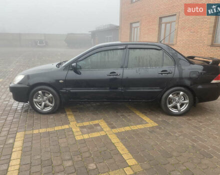 Черный Мицубиси Лансер, объемом двигателя 1.58 л и пробегом 211 тыс. км за 6333 $, фото 10 на Automoto.ua