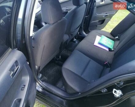 Мицубиси Лансер 2008 в Киеве на Automoto.ua Черный Мицубиси Лансер, объемом двигателя 2 л и пробегом 196 тыс. км за 5500 $, фото 21 на Automoto.ua