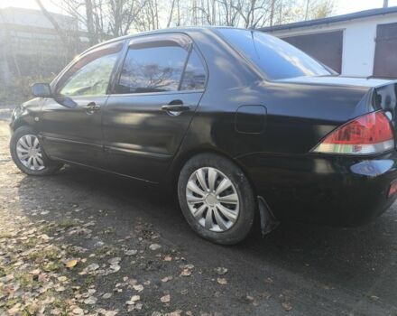 Черный Мицубиси Лансер, объемом двигателя 1.6 л и пробегом 243 тыс. км за 3200 $, фото 3 на Automoto.ua