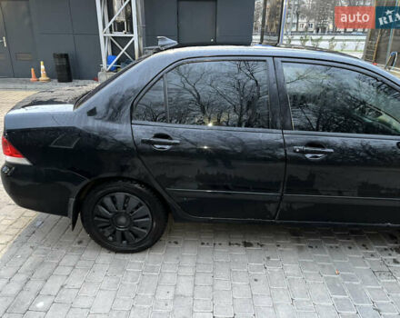 Чорний Міцубісі Lancer, об'ємом двигуна 1.6 л та пробігом 277 тис. км за 3900 $, фото 16 на Automoto.ua