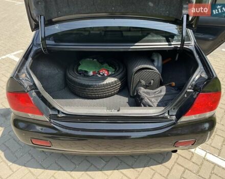 Чорний Міцубісі Lancer, об'ємом двигуна 1.6 л та пробігом 296 тис. км за 4200 $, фото 49 на Automoto.ua