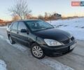 Черный Мицубиси Лансер, объемом двигателя 1.6 л и пробегом 330 тыс. км за 3350 $, фото 1 на Automoto.ua