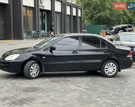 Черный Мицубиси Лансер, объемом двигателя 1.6 л и пробегом 167 тыс. км за 4850 $, фото 4 на Automoto.ua