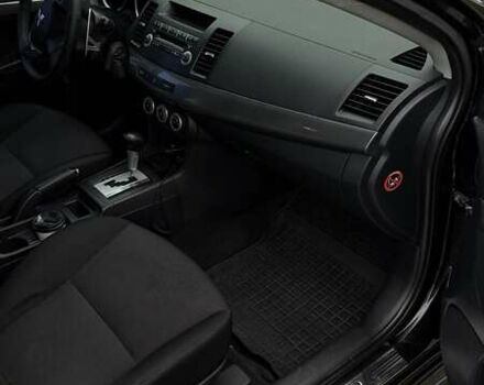 Черный Мицубиси Лансер, объемом двигателя 2 л и пробегом 222 тыс. км за 6000 $, фото 2 на Automoto.ua