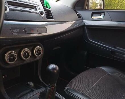 Черный Мицубиси Лансер, объемом двигателя 2 л и пробегом 214 тыс. км за 6300 $, фото 1 на Automoto.ua