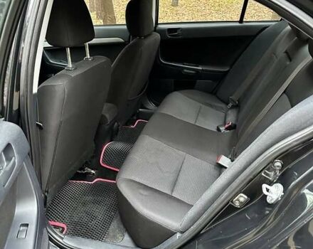 Черный Мицубиси Лансер, объемом двигателя 2 л и пробегом 216 тыс. км за 5600 $, фото 8 на Automoto.ua