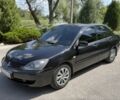 Черный Мицубиси Лансер, объемом двигателя 1.6 л и пробегом 259 тыс. км за 3692 $, фото 1 на Automoto.ua