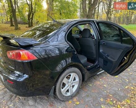 Чорний Міцубісі Lancer, об'ємом двигуна 2 л та пробігом 237 тис. км за 7500 $, фото 23 на Automoto.ua