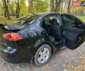 Чорний Міцубісі Lancer, об'ємом двигуна 2 л та пробігом 237 тис. км за 7500 $, фото 23 на Automoto.ua