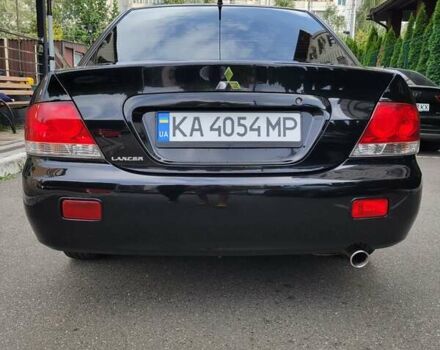Чорний Міцубісі Lancer, об'ємом двигуна 1.58 л та пробігом 334 тис. км за 4750 $, фото 8 на Automoto.ua