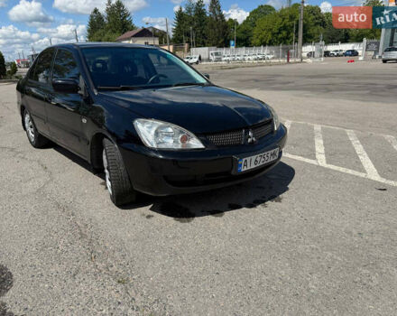 Чорний Міцубісі Lancer, об'ємом двигуна 1.6 л та пробігом 292 тис. км за 3600 $, фото 1 на Automoto.ua