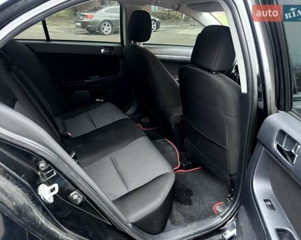 Черный Мицубиси Лансер, объемом двигателя 2 л и пробегом 217 тыс. км за 7000 $, фото 7 на Automoto.ua