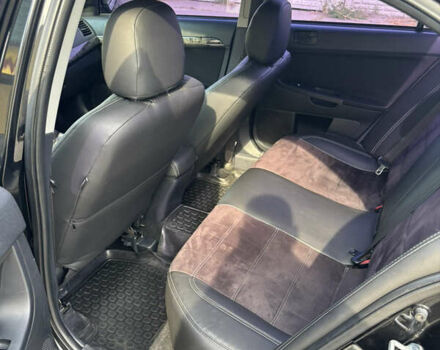 Чорний Міцубісі Lancer, об'ємом двигуна 1.5 л та пробігом 210 тис. км за 5500 $, фото 27 на Automoto.ua