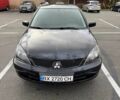 Чорний Міцубісі Lancer, об'ємом двигуна 1.6 л та пробігом 245 тис. км за 4500 $, фото 1 на Automoto.ua