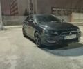 Черный Мицубиси Лансер, объемом двигателя 2 л и пробегом 240 тыс. км за 6400 $, фото 1 на Automoto.ua