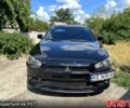 Чорний Міцубісі Lancer, об'ємом двигуна 2 л та пробігом 188 тис. км за 7000 $, фото 1 на Automoto.ua