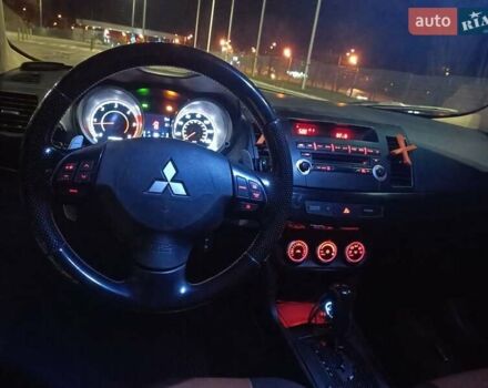 Черный Мицубиси Лансер, объемом двигателя 2 л и пробегом 240 тыс. км за 6400 $, фото 16 на Automoto.ua