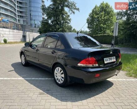 Чорний Міцубісі Lancer, об'ємом двигуна 1.6 л та пробігом 296 тис. км за 4200 $, фото 6 на Automoto.ua