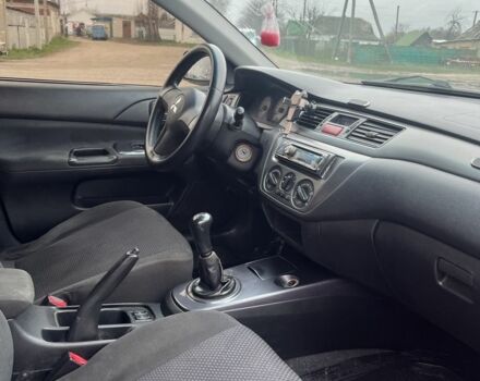 Черный Мицубиси Лансер, объемом двигателя 1.6 л и пробегом 1 тыс. км за 3750 $, фото 4 на Automoto.ua