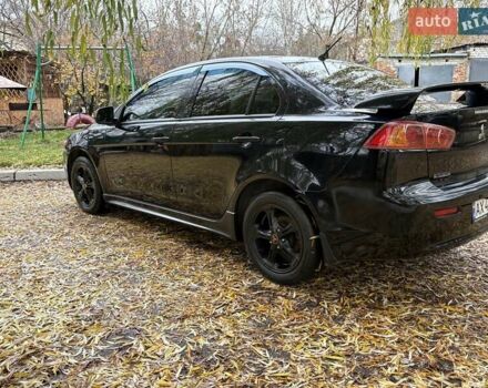 Черный Мицубиси Лансер, объемом двигателя 2 л и пробегом 260 тыс. км за 6100 $, фото 4 на Automoto.ua